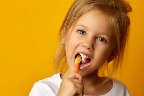 pediatric dentistry young girl brushing teeth