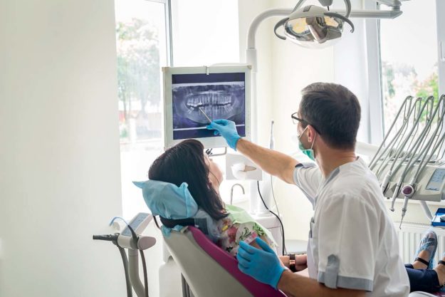 dentists open on saturday woman getting dental exam at the Dentists Open on Saturday