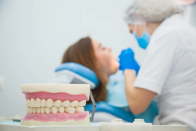 What is a Dental Emergency a woman gets treatment for a dental emergency