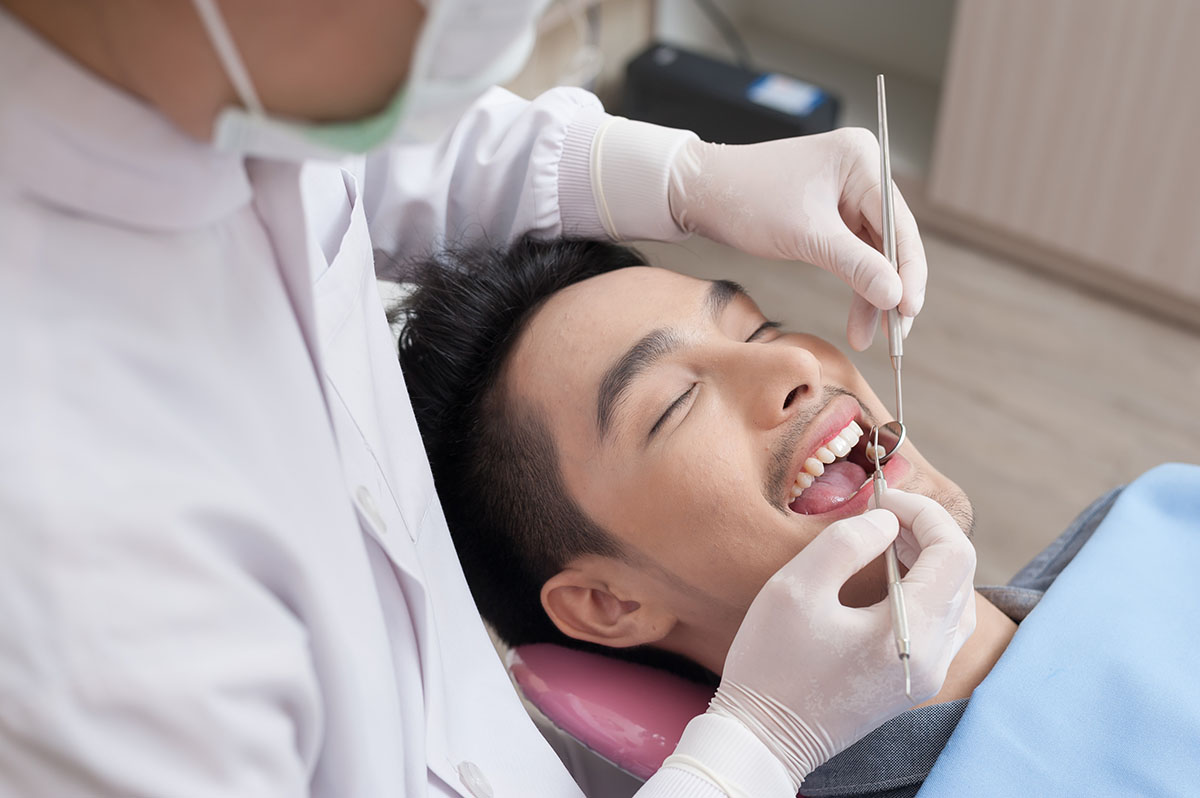 dental health services man getting Emergency Dental Health Services