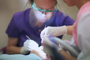 woman receives restorative dentistry services