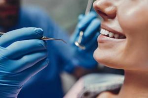 a woman benefits from a specialty dentist